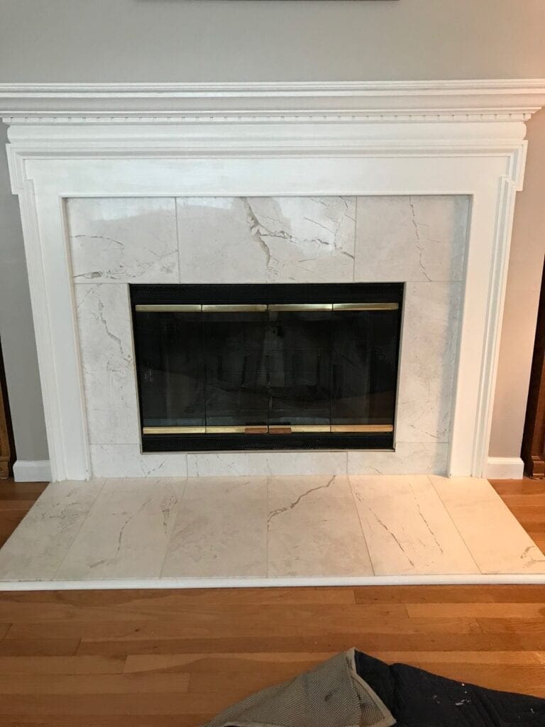 White marble wood burning fireplace